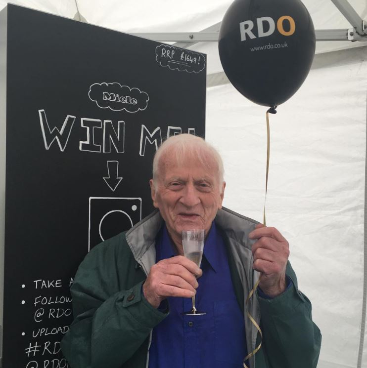 Our founder, Ken Sargant, enjoying a glass of bubbly at a company event